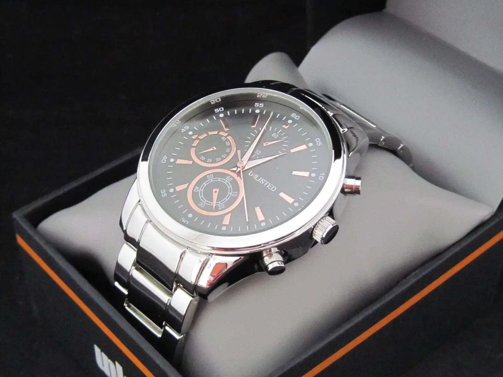 Stainless steel watch close-up.