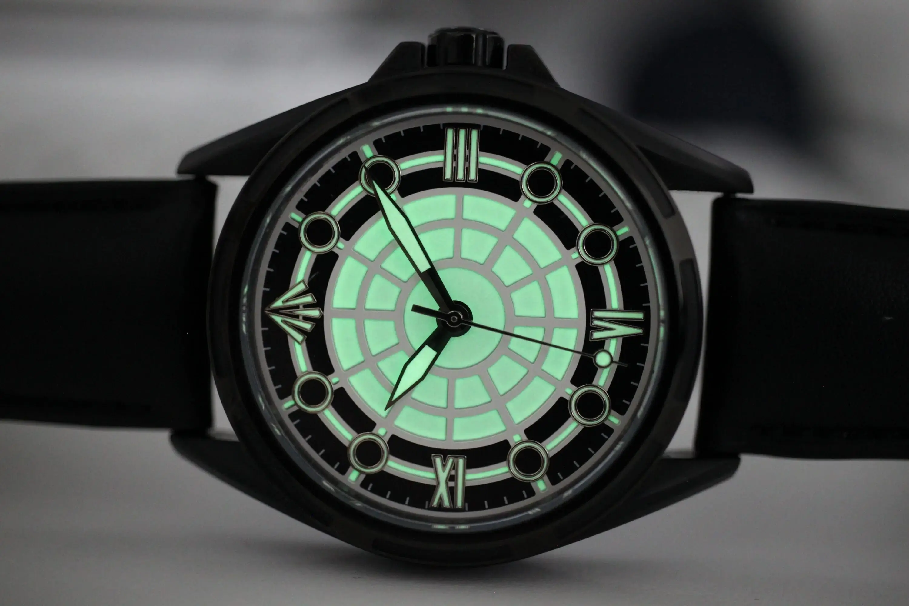 A watch with a dark dial.