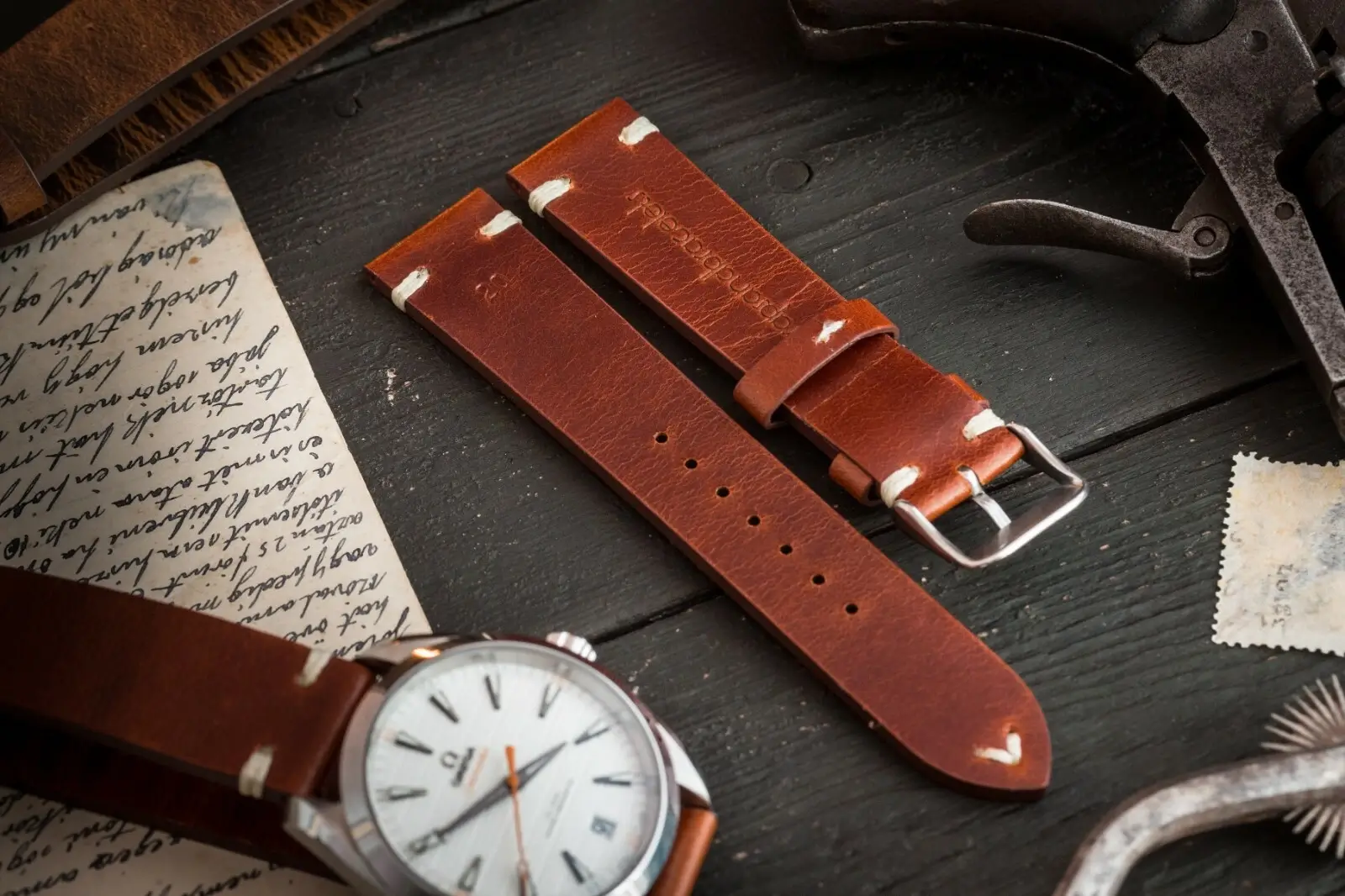 A leather watch strap being stitched.