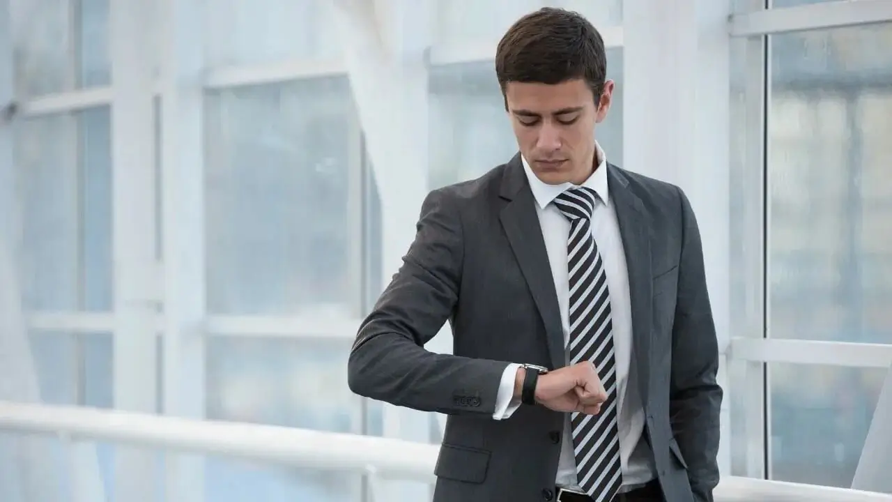 A client being shown a watch by an ambassador.